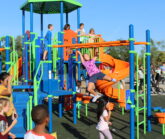 Delaware students playing on new playground equipment