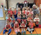 Preschoolers with new books