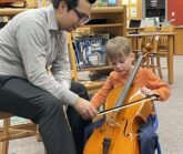 Teaching a student on a cello