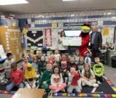 Liz Moore's 1st Grade class receives grant check from ISU Cy and GICU CEO