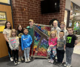 Runnells Students Showing Off Collaborative Art Piece 2024